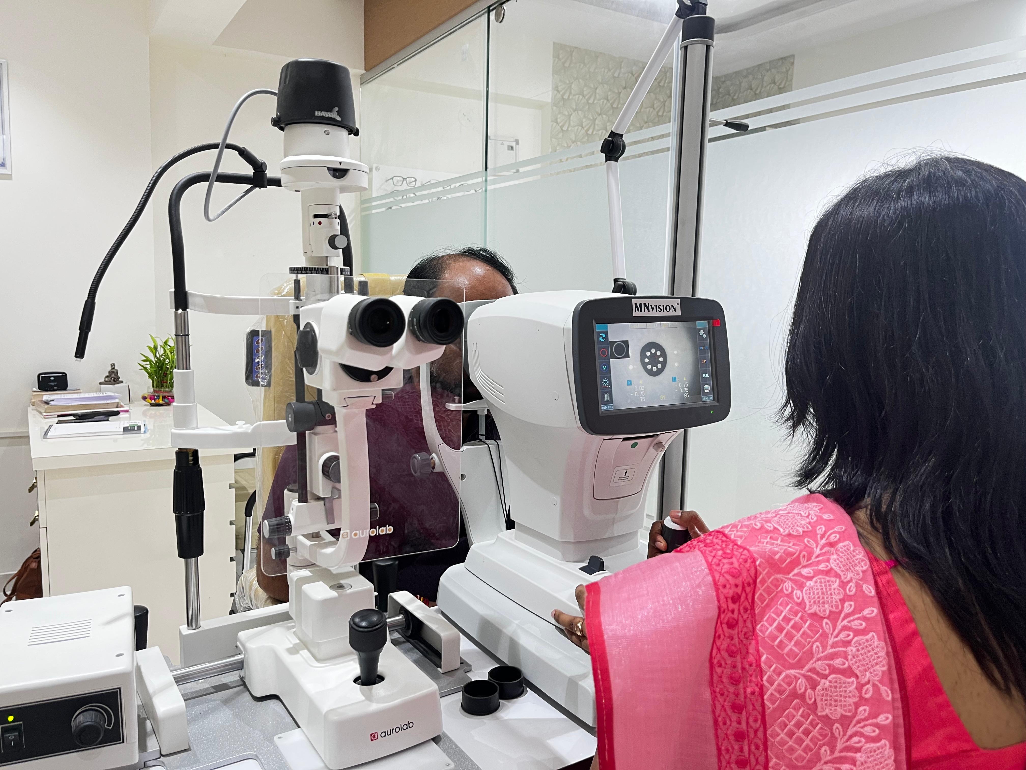Side view of woman getting her eyes checked